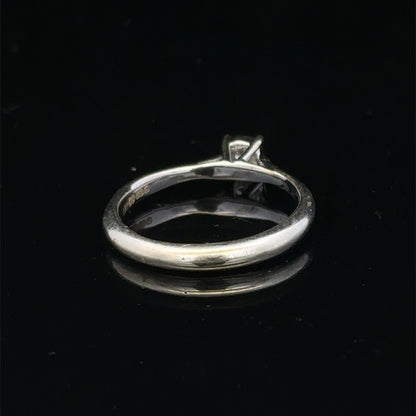 9ct white gold diamond solitaire ring by Reeves and Sons featuring a sparkling central diamond and elegant band design.
