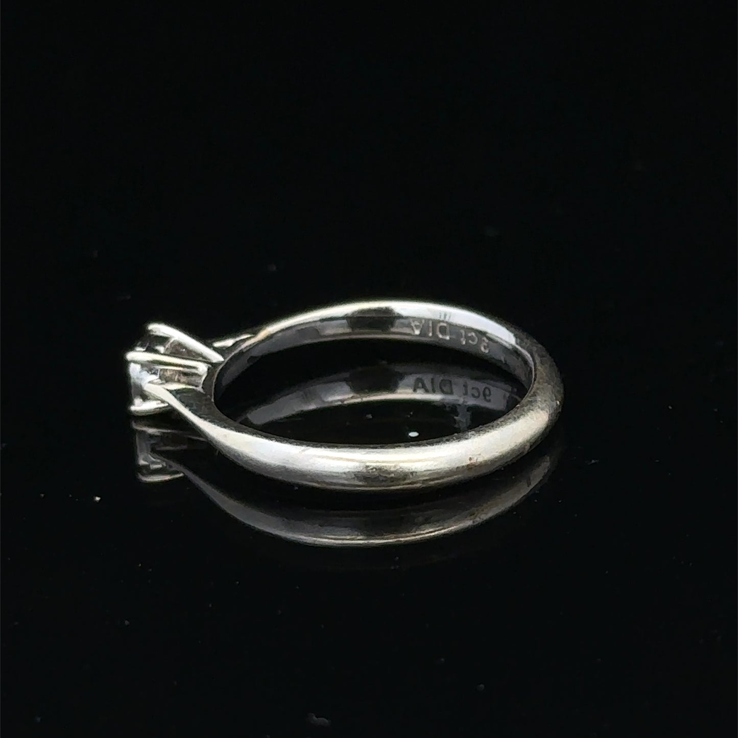 9ct white gold diamond solitaire ring by Reeves and Sons, featuring a single sparkling diamond setting.