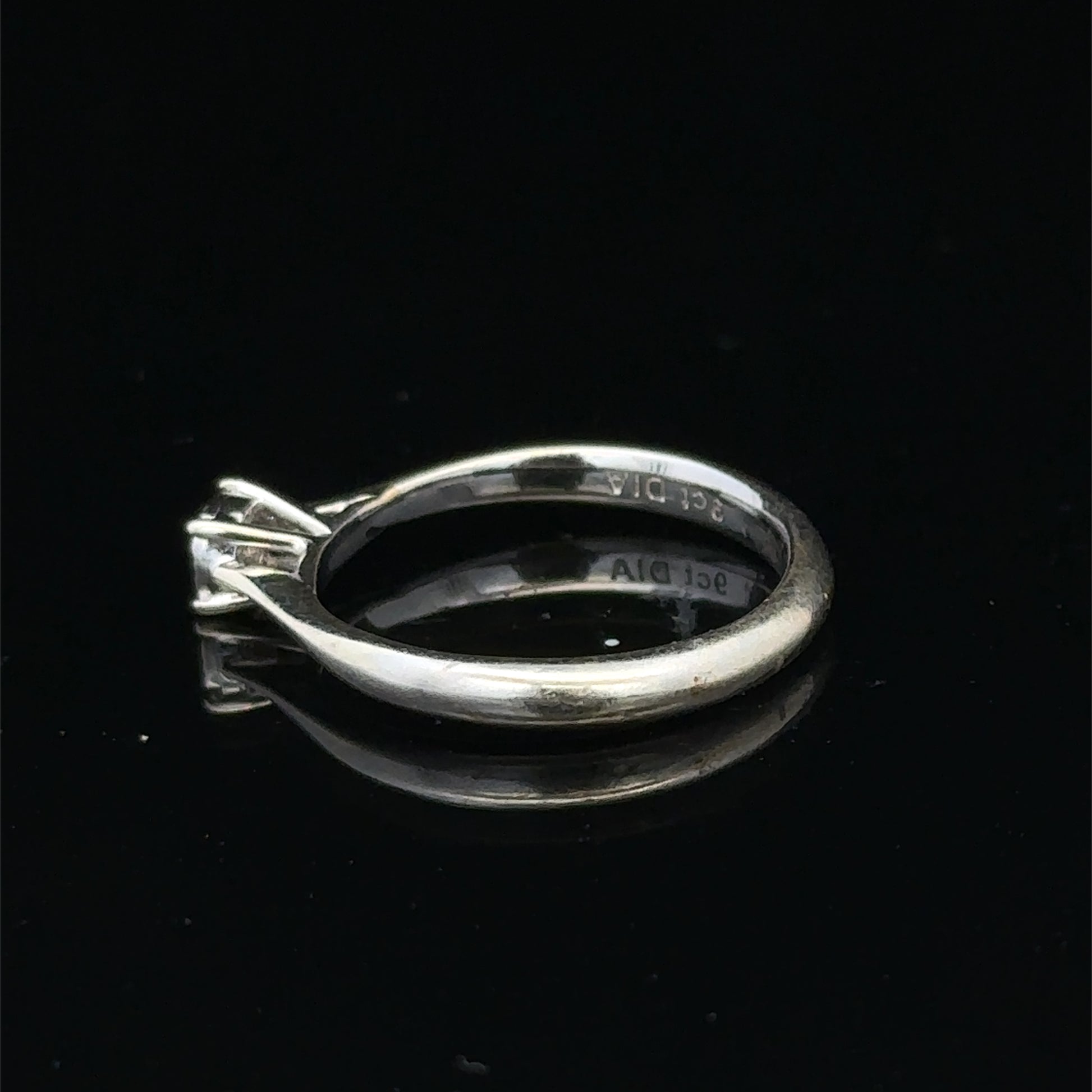 9ct white gold diamond solitaire ring by Reeves and Sons, featuring a single sparkling diamond setting.