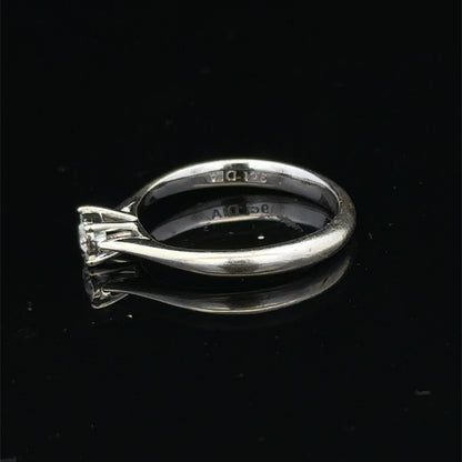 9ct white gold diamond solitaire ring by Reeves and Sons featuring a sparkling central diamond and elegant band.