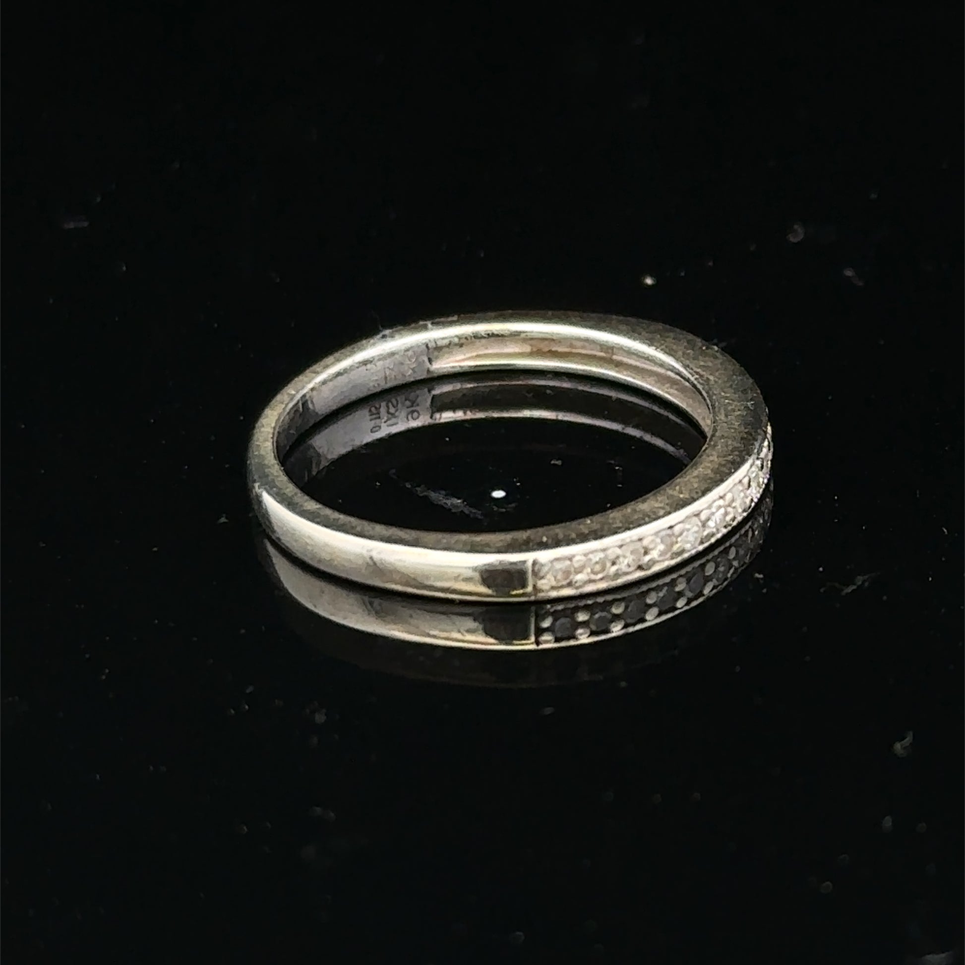 9ct white gold diamond half eternity ring with sparkling diamonds, showcasing Reeves and Sons craftsmanship.