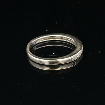 9ct white gold diamond half eternity ring with sparkling diamonds, crafted by Reeves and Sons, shown close-up.