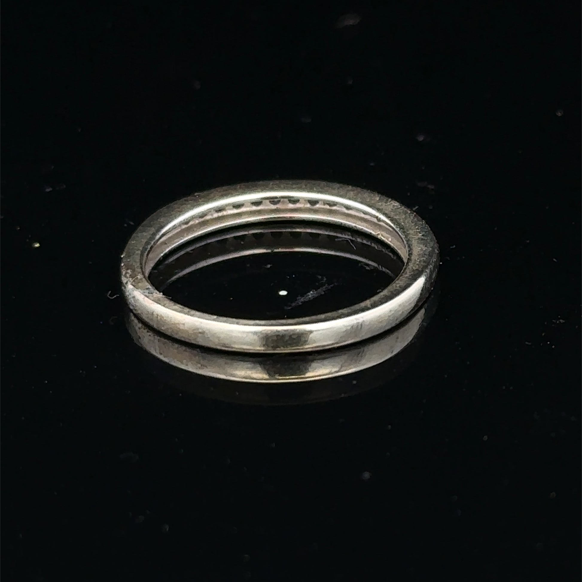 9ct white gold diamond half eternity ring with sparkling diamonds, showcasing Reeves and Sons craftsmanship.
