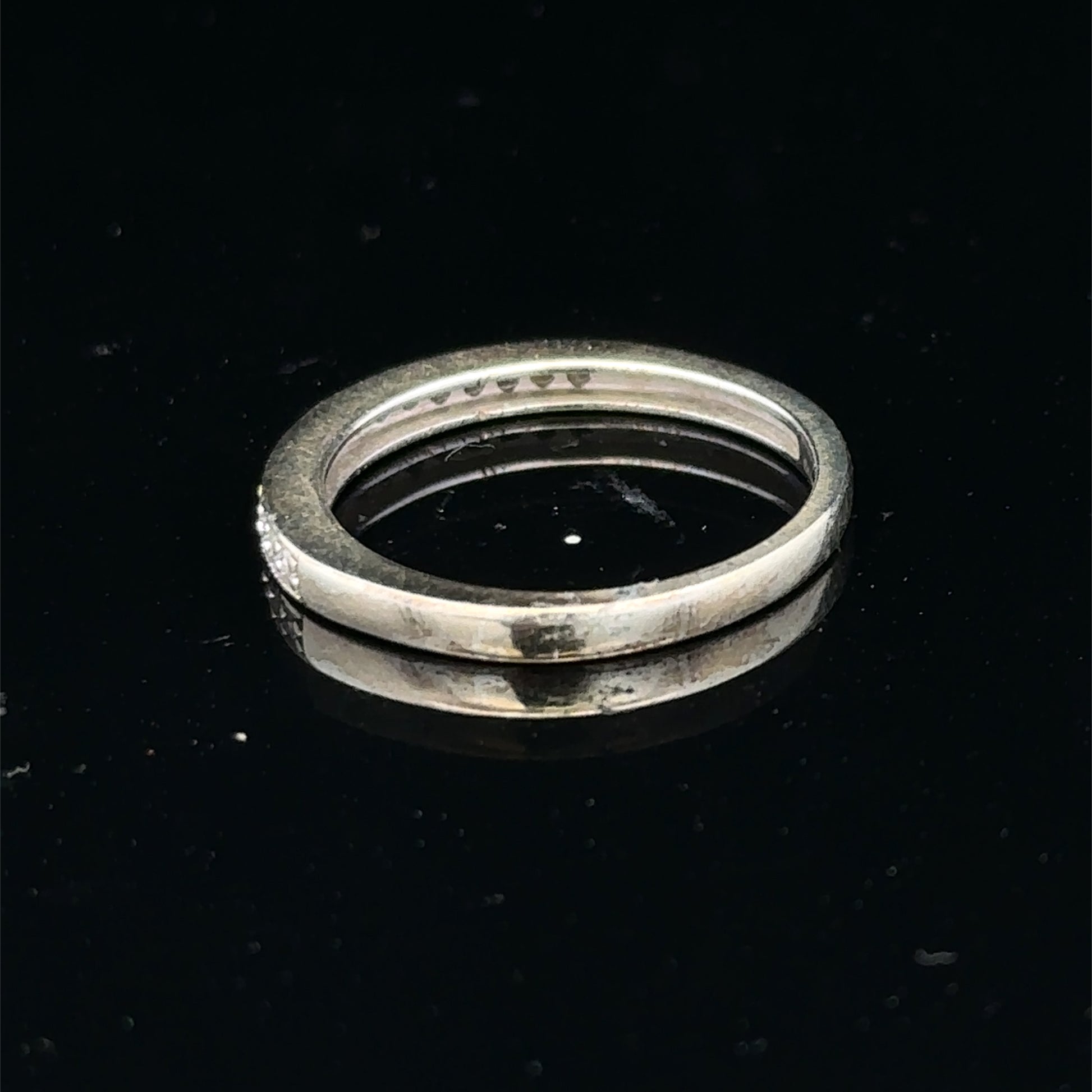 9ct white gold diamond half eternity ring with sparkling diamonds, showcasing Reeves and Sons craftsmanship.