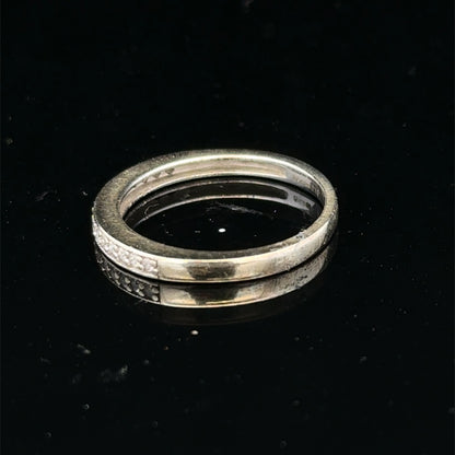 9ct white gold diamond half eternity ring with sparkling diamonds, crafted by Reeves and Sons, showcasing a elegant and timeless design.