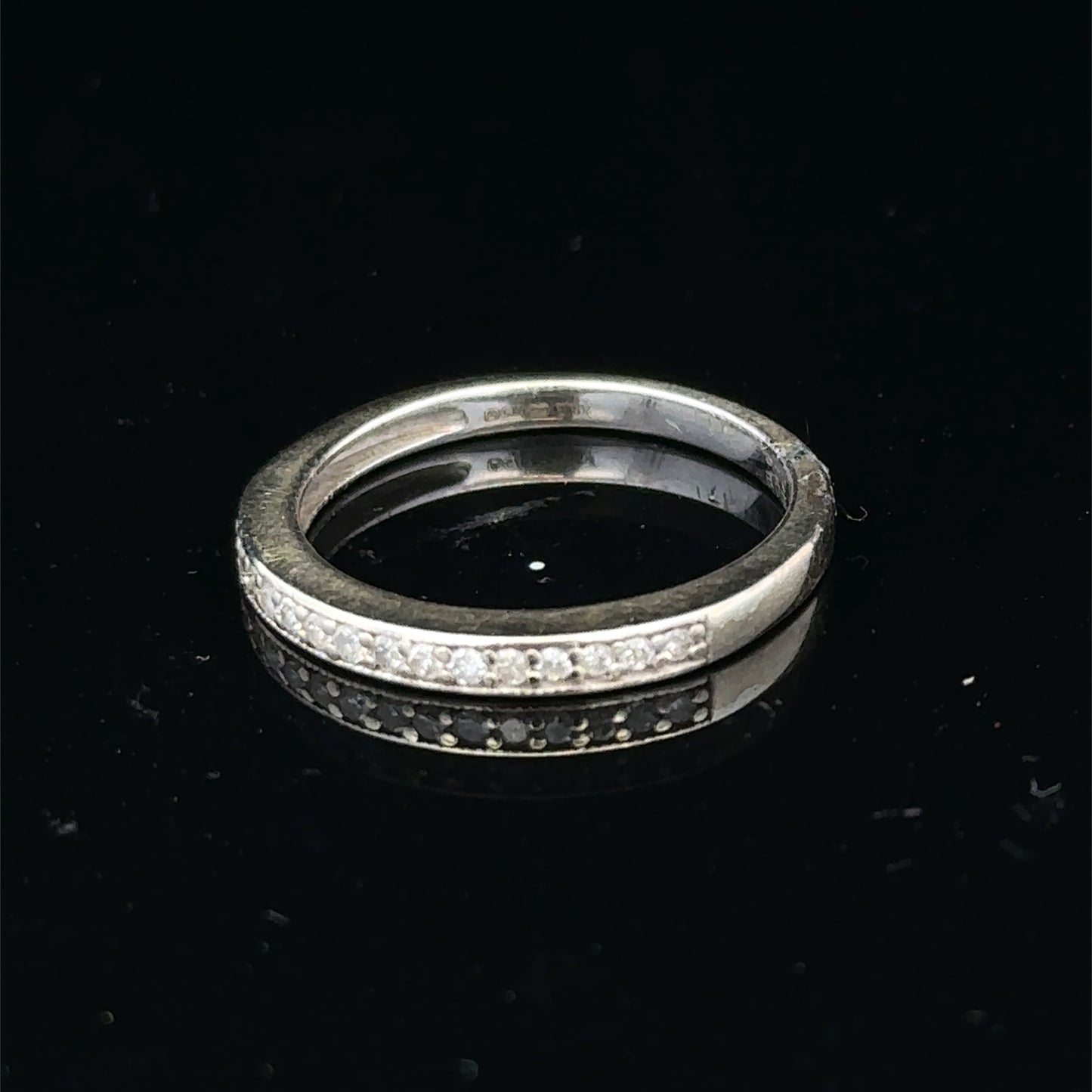 9ct white gold diamond half eternity ring with sparkling diamonds, stylish band, from Reeves and Sons.