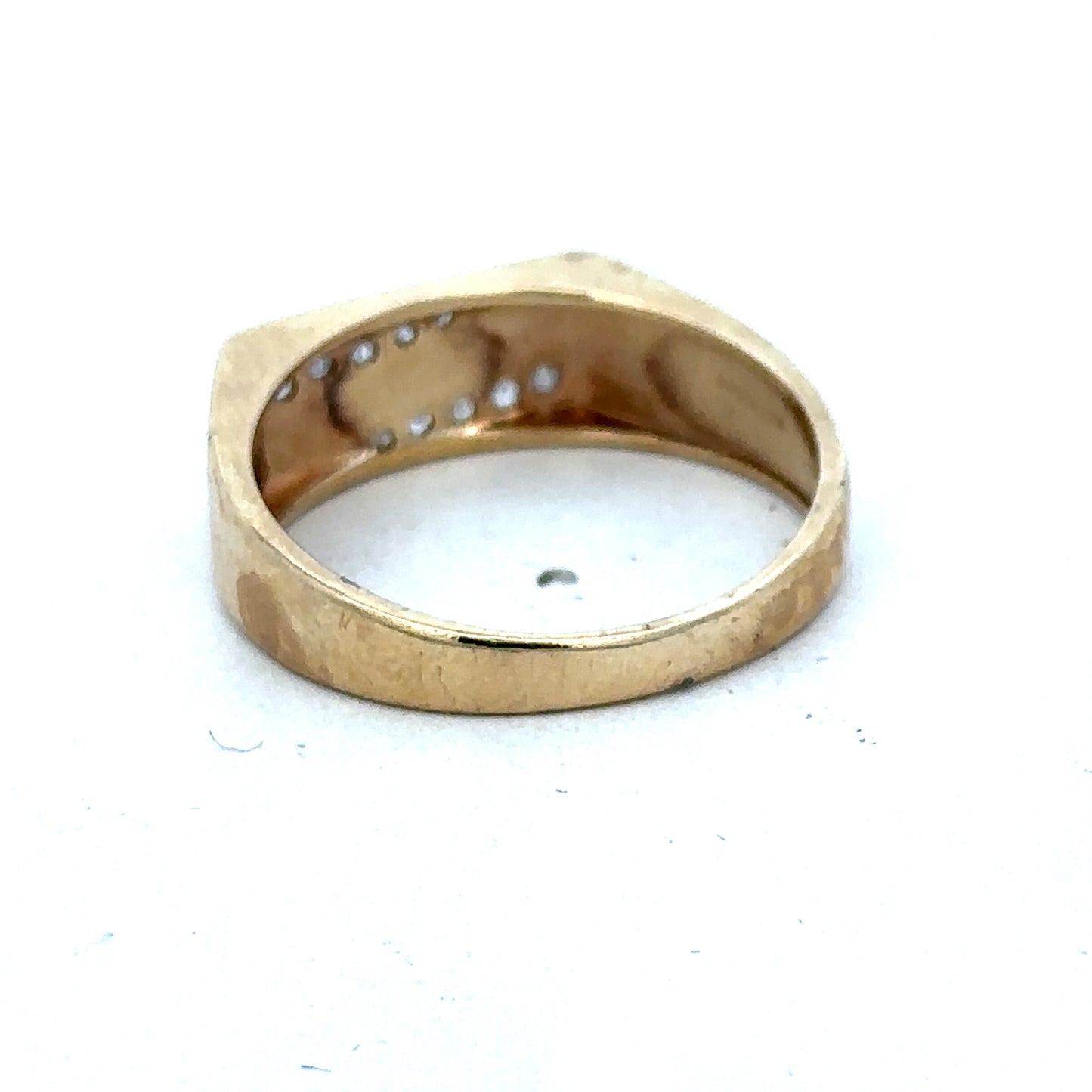 9ct yellow gold diamond ring size V by Reeves and Sons, featuring a sparkling diamond design on a polished band.