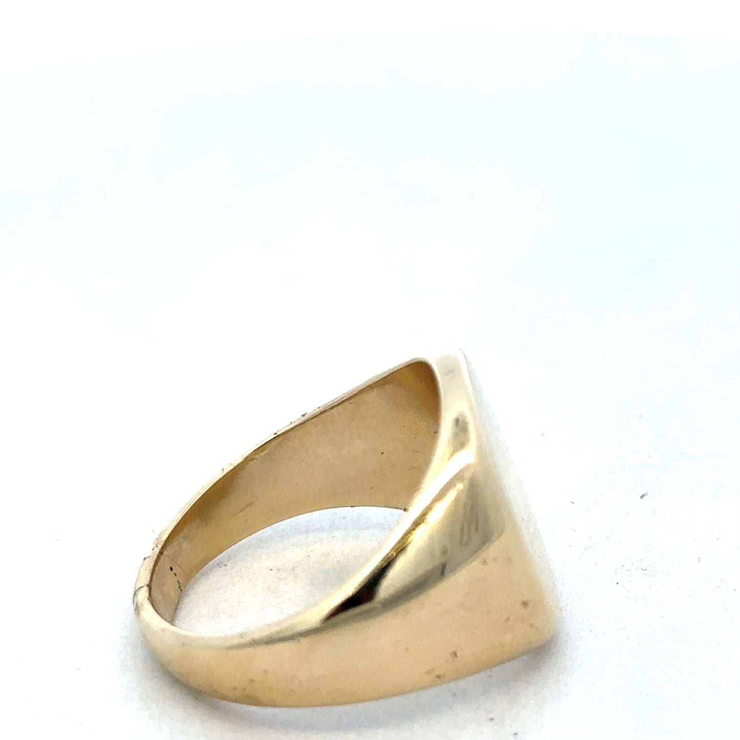 9ct yellow gold signet ring by Reeves and Sons, featuring a polished surface and classic design, displayed on a neutral background.