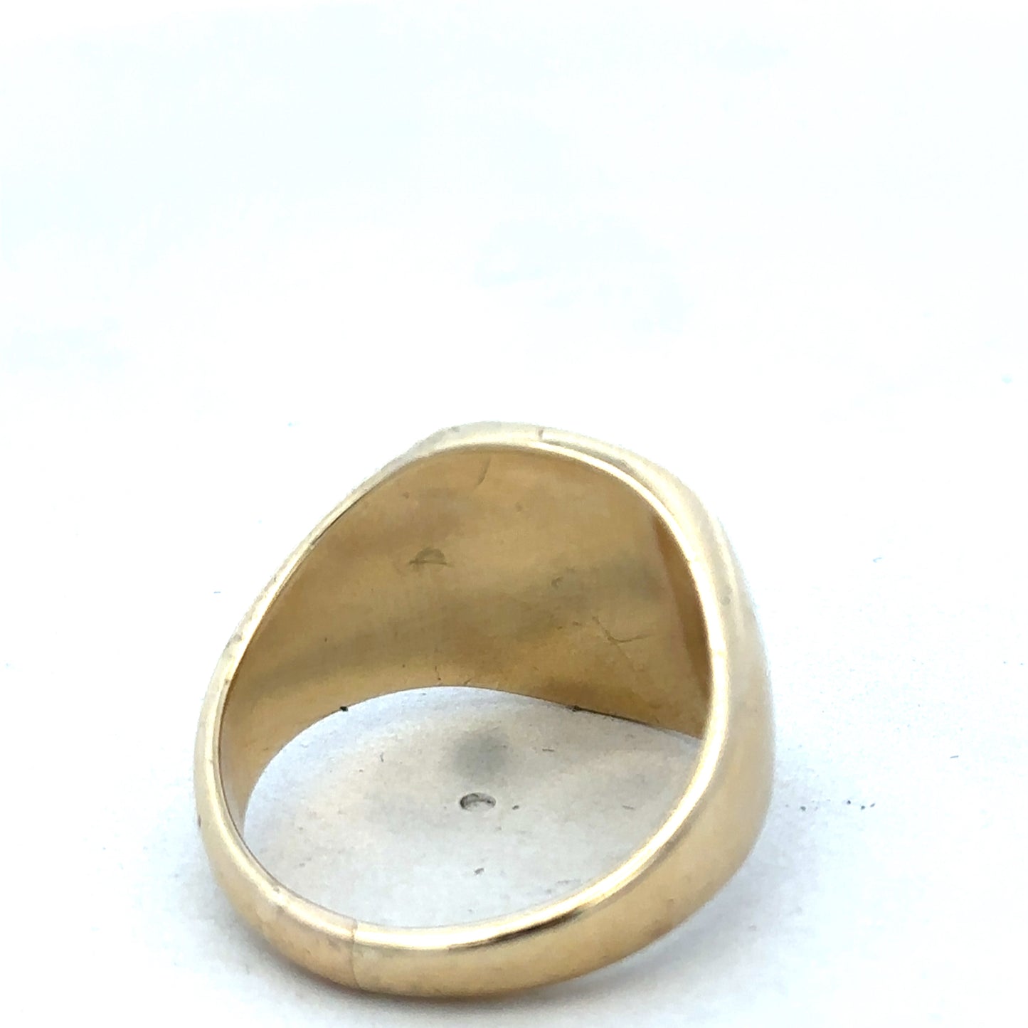 9ct yellow gold signet ring by Reeves and Sons, featuring a smooth polished surface and classic design.