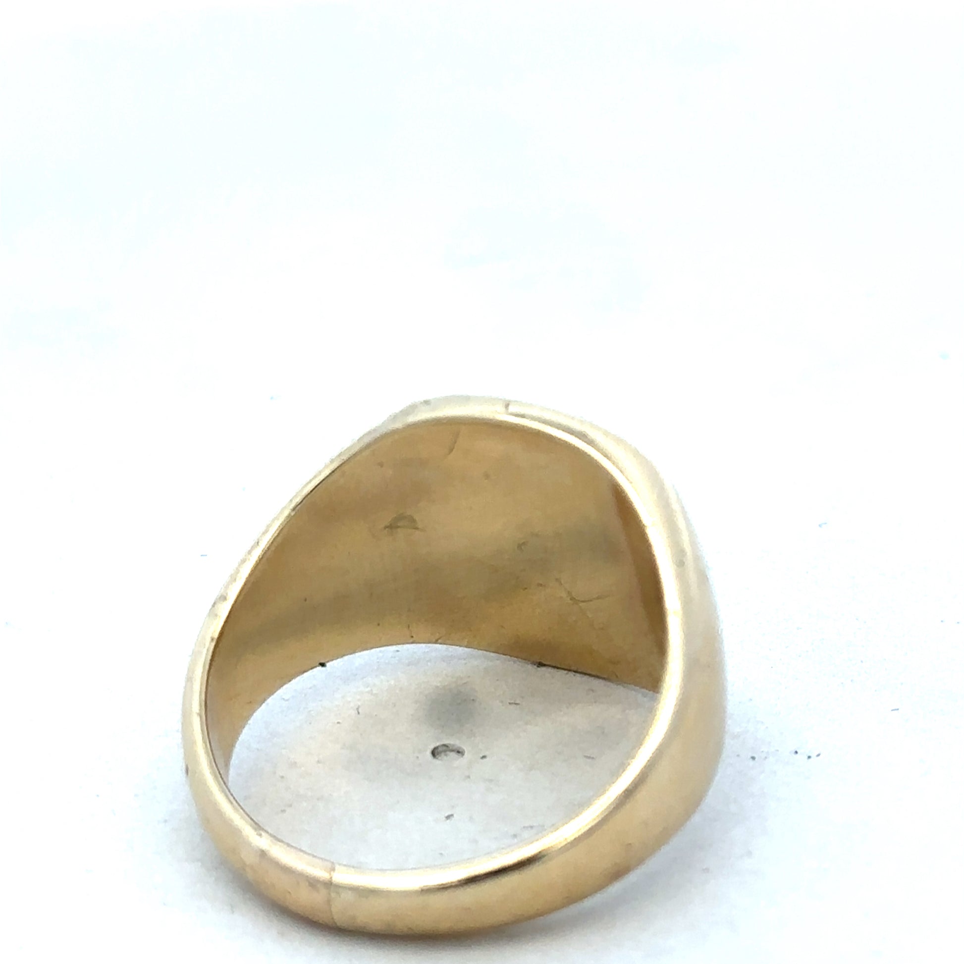 9ct yellow gold signet ring by Reeves and Sons, featuring a smooth polished surface and classic design.