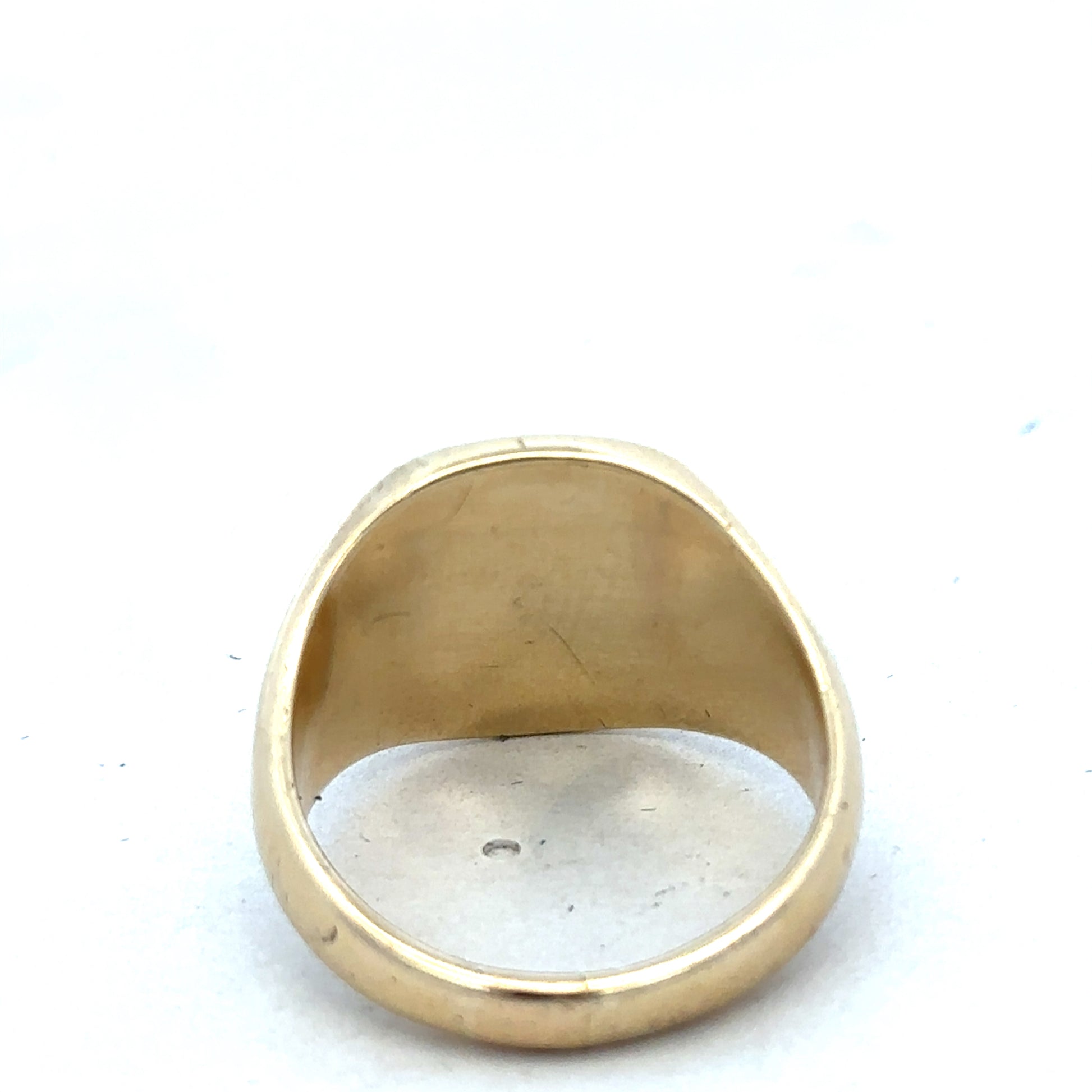 9ct yellow gold signet ring by Reeves and Sons, showcasing a smooth, polished surface and classic design.