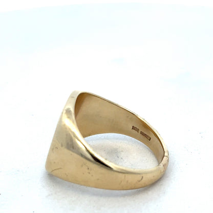 9ct yellow gold signet ring by Reeves and Sons, featuring a polished smooth surface and classic design.