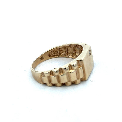 9ct yellow gold diamond ring by Reeves and Sons, showcasing a sparkling diamond set in a polished gold band.