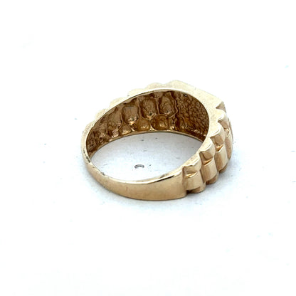 9ct yellow gold diamond ring by Reeves and Sons, showcasing a sparkling diamond set in a polished gold band.