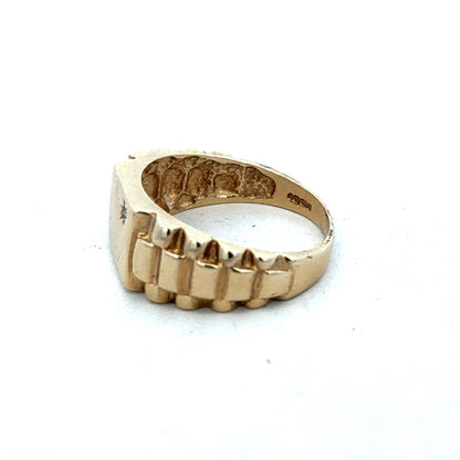 9ct yellow gold diamond ring by Reeves and Sons, featuring a sparkling diamond centerpiece and elegant design.