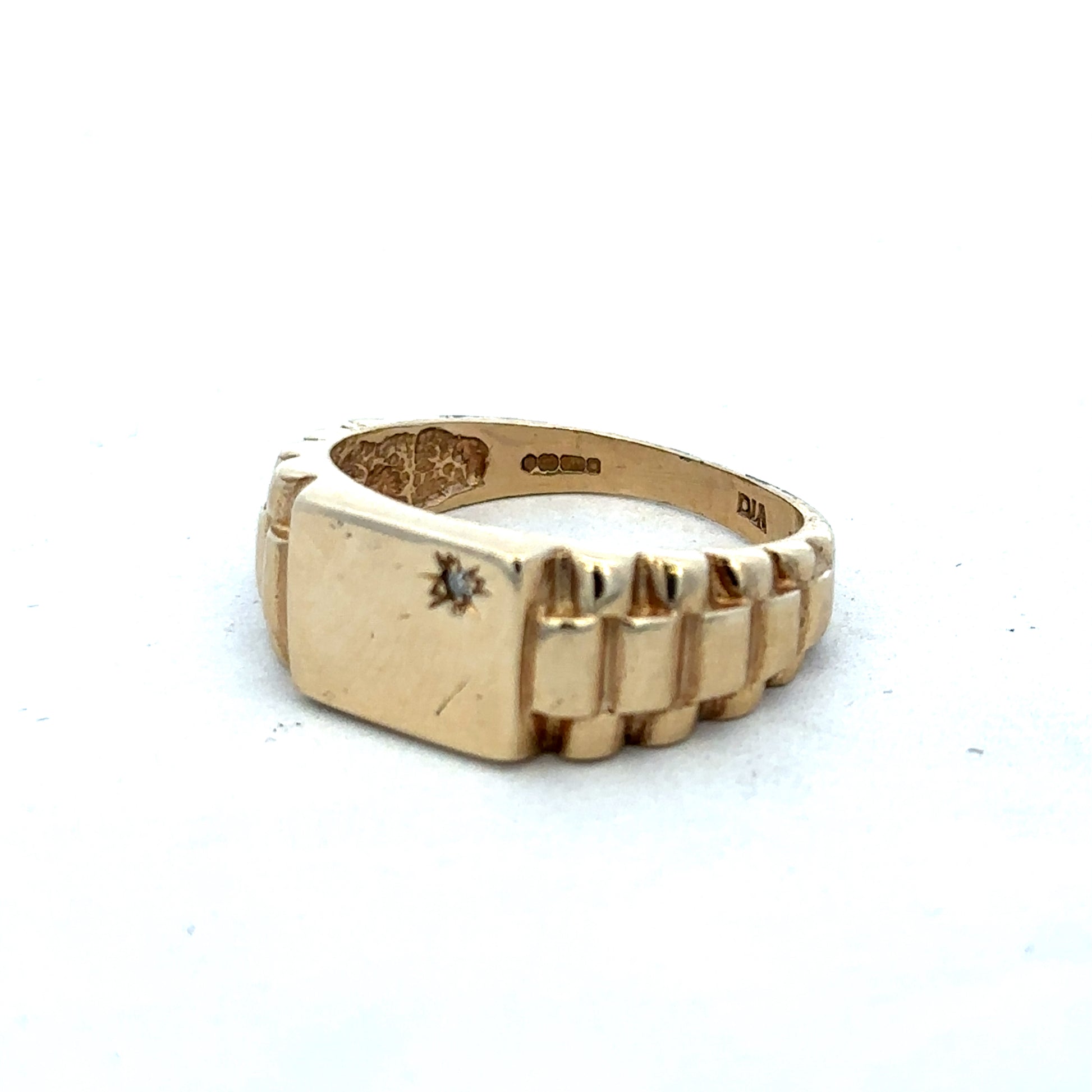 9ct yellow gold diamond ring by Reeves and Sons with sparkling diamonds set in a classic band design.