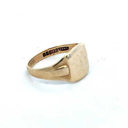 9ct yellow gold ring by Reeves and Sons, featuring a smooth, polished band with a classic design.