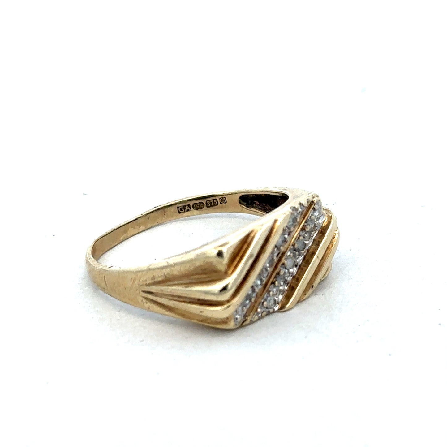 9ct yellow gold diamond ring by Reeves and Sons featuring a sparkling diamond set in a sleek band.
