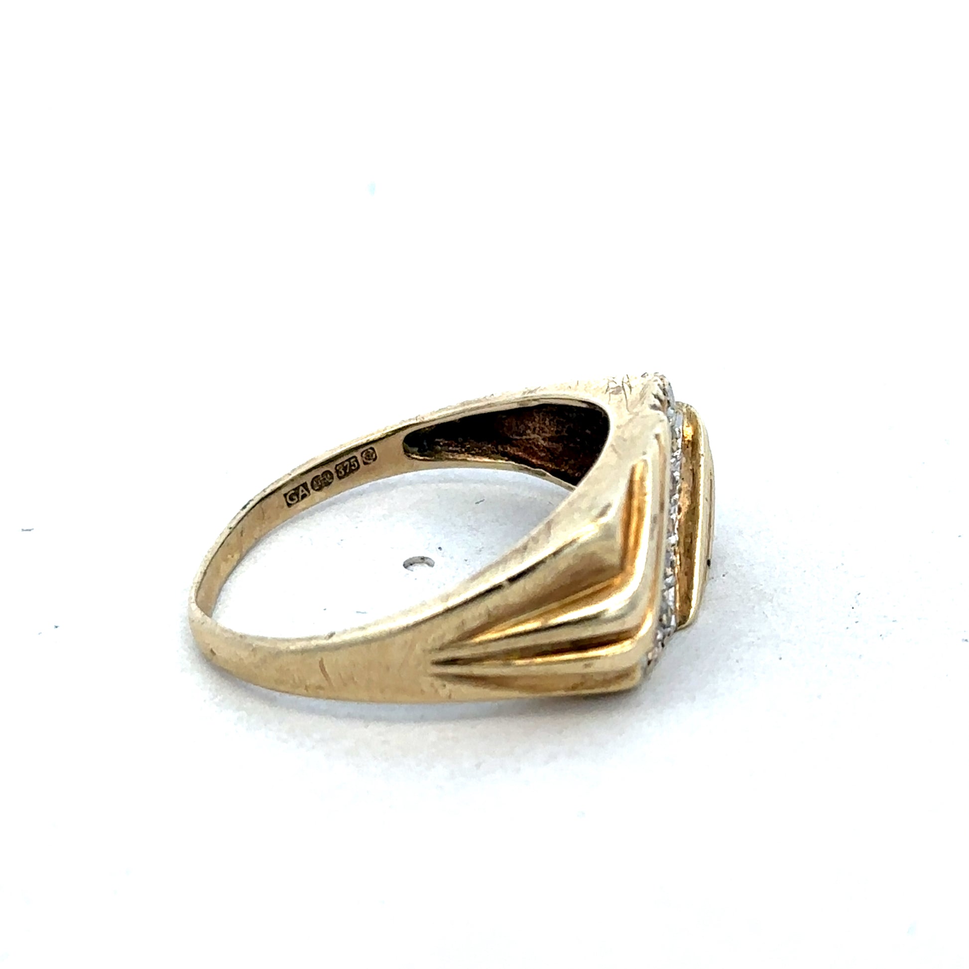 9ct yellow gold diamond ring by Reeves and Sons, featuring a sparkling diamond setting on a polished band.