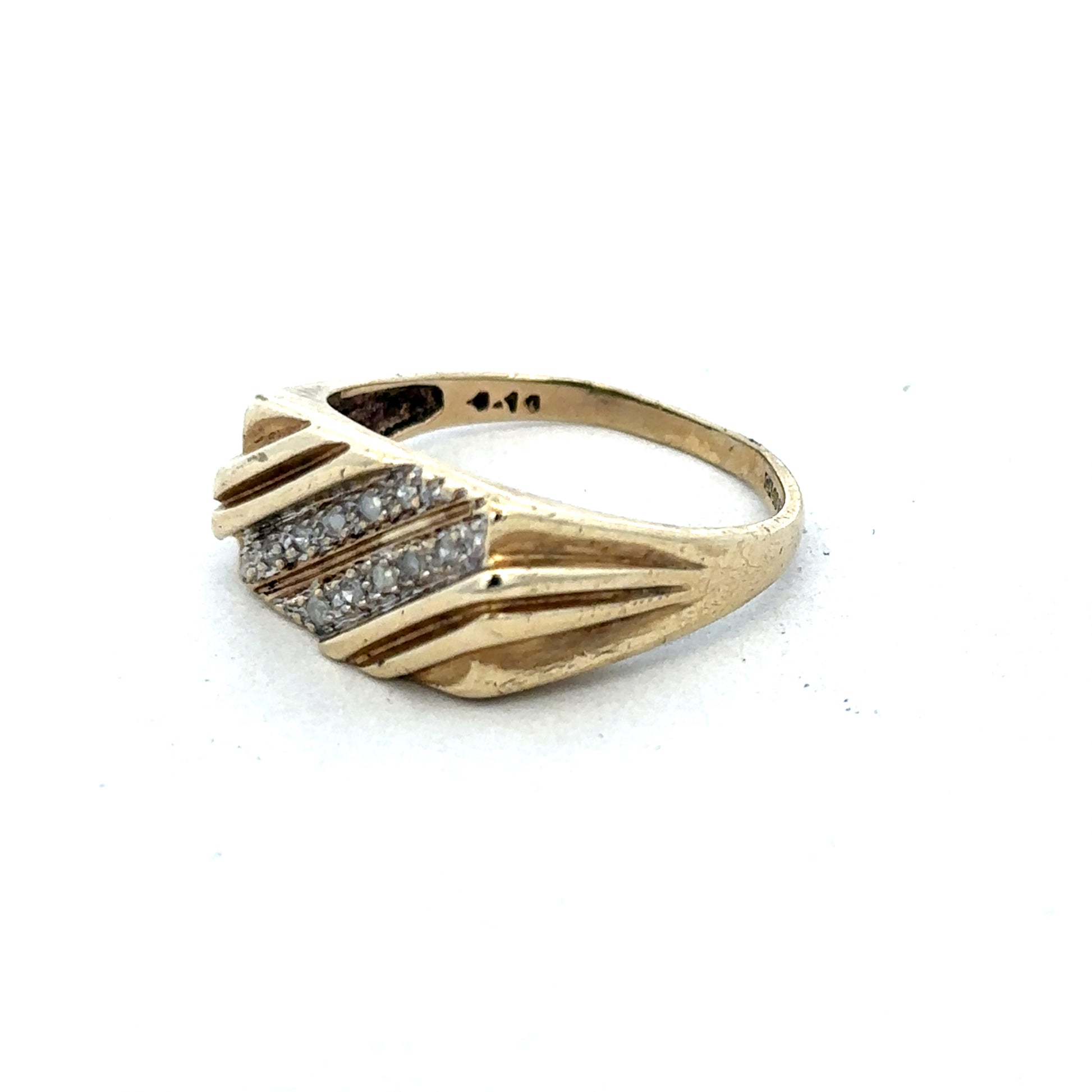 9ct yellow gold diamond ring by Reeves and Sons, featuring a sparkling diamond set in a polished gold band.