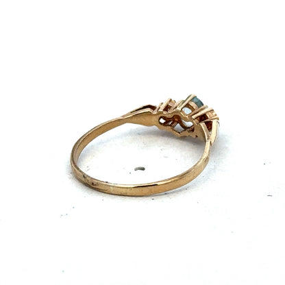 9ct yellow gold diamond ring by Reeves and Sons, showcasing a elegant band with sparkling diamonds and intricate detailing.