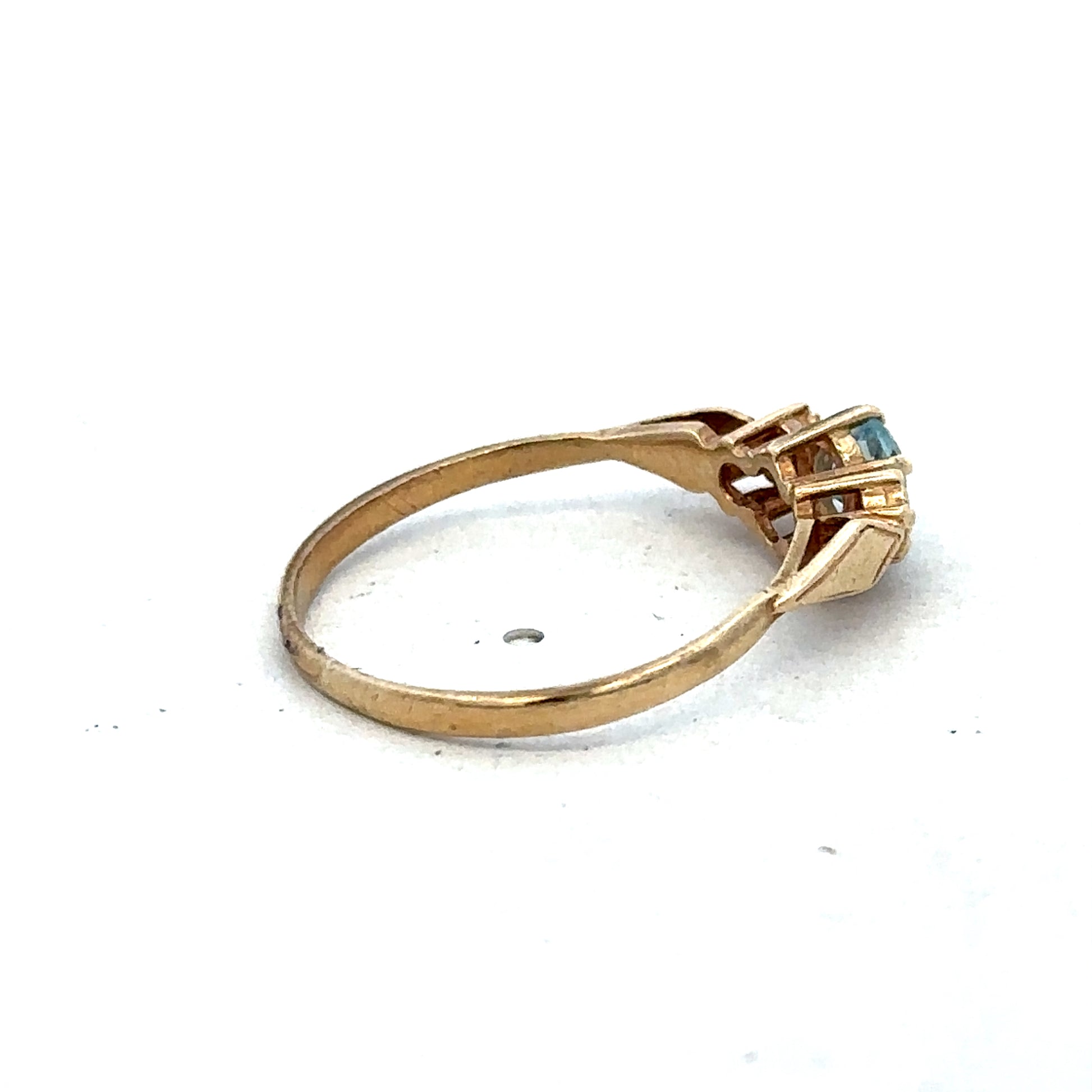 9ct yellow gold diamond ring by Reeves and Sons, featuring a sparkling diamond centerpiece and elegant band design.