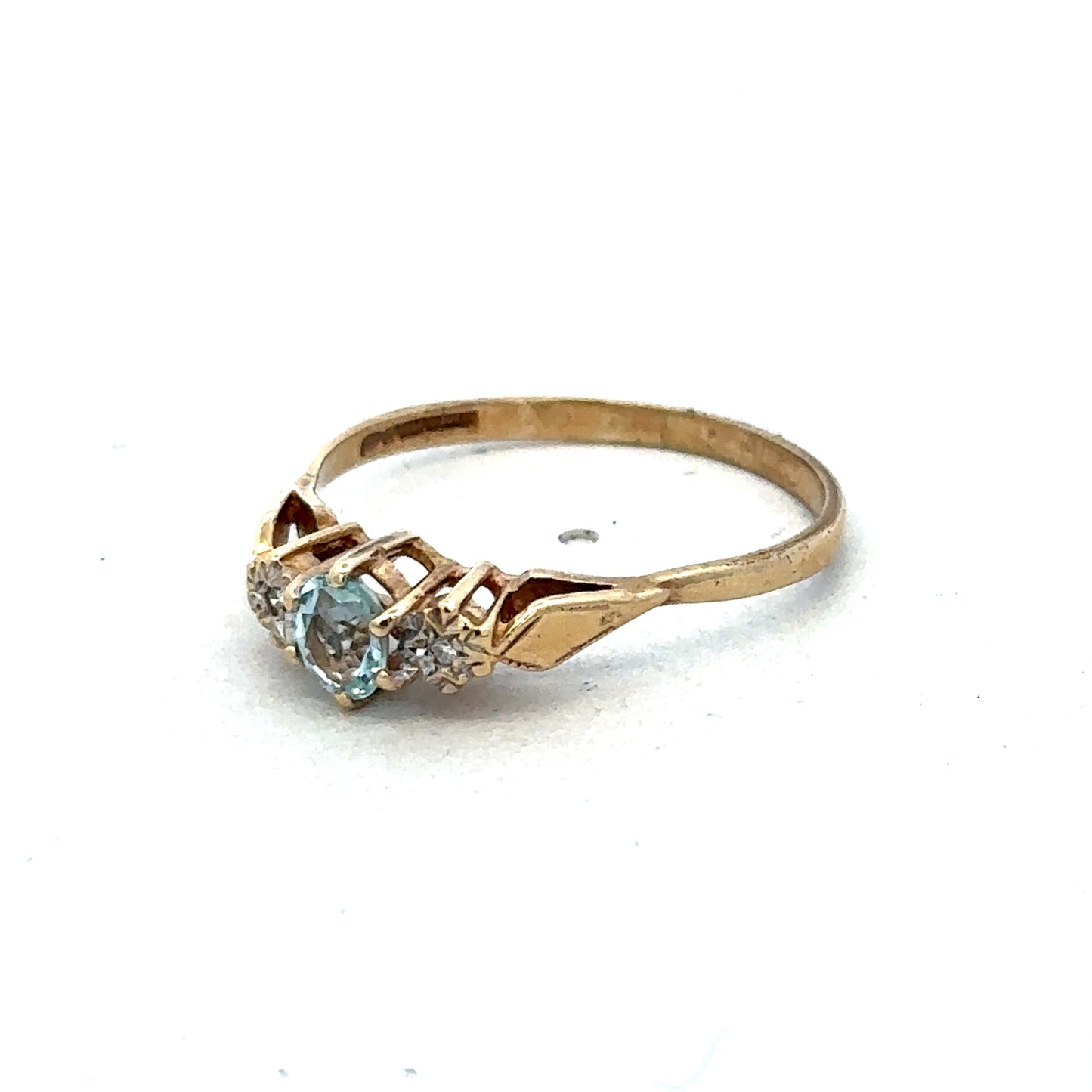 9ct yellow gold diamond ring by Reeves and Sons, showcasing a sparkling diamond set in a polished gold band.