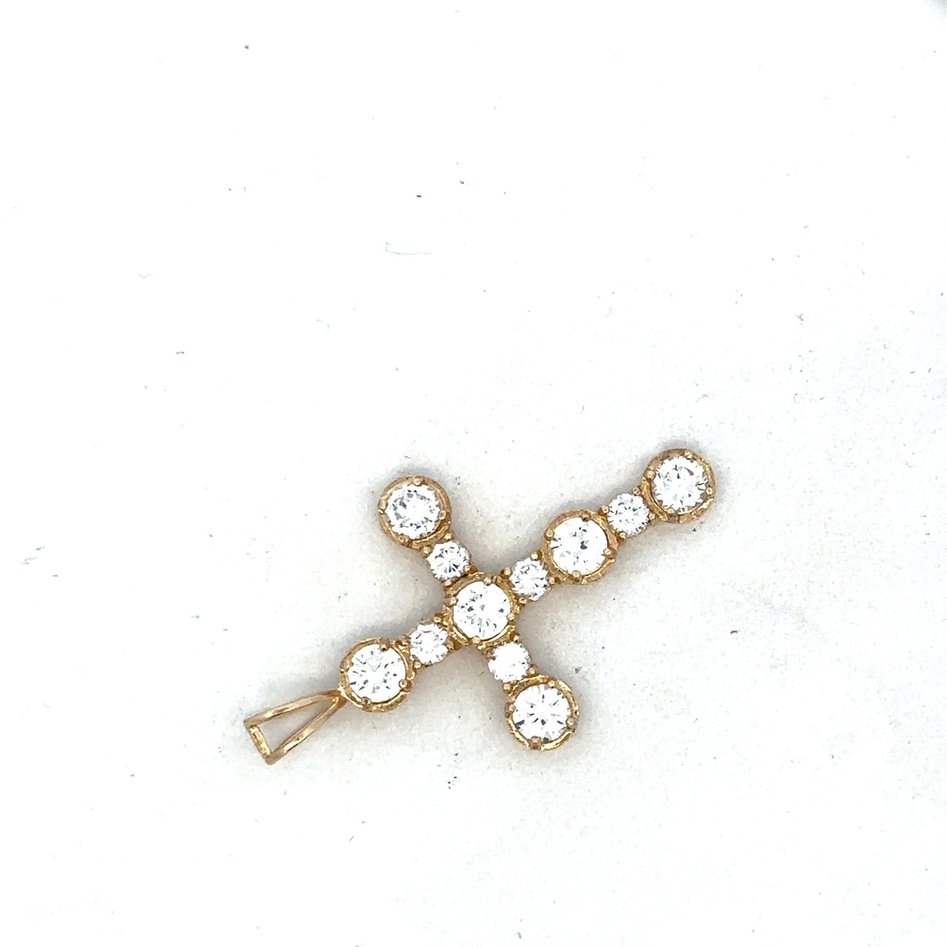 9ct yellow gold cross pendant by Reeves and Sons, showcasing a detailed religious jewelry design.
