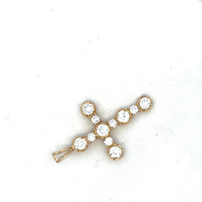9ct yellow gold cross pendant by Reeves and Sons, showcasing a detailed religious jewelry design.