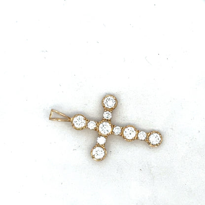 9ct yellow gold cross pendant from Reeves and Sons, featuring a simple, elegant design with polished finish.