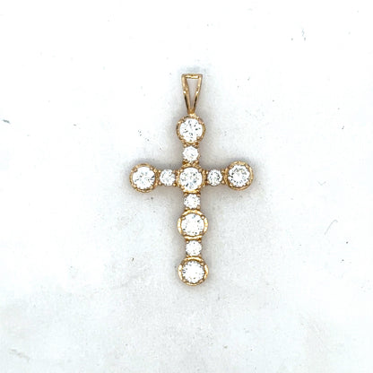 9ct yellow gold cross pendant by Reeves and Sons, featuring a detailed religious symbol with polished finish.