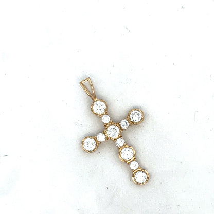 9ct yellow gold cross pendant by Reeves and Sons, showcasing a detailed religious jewelry design with polished finish.