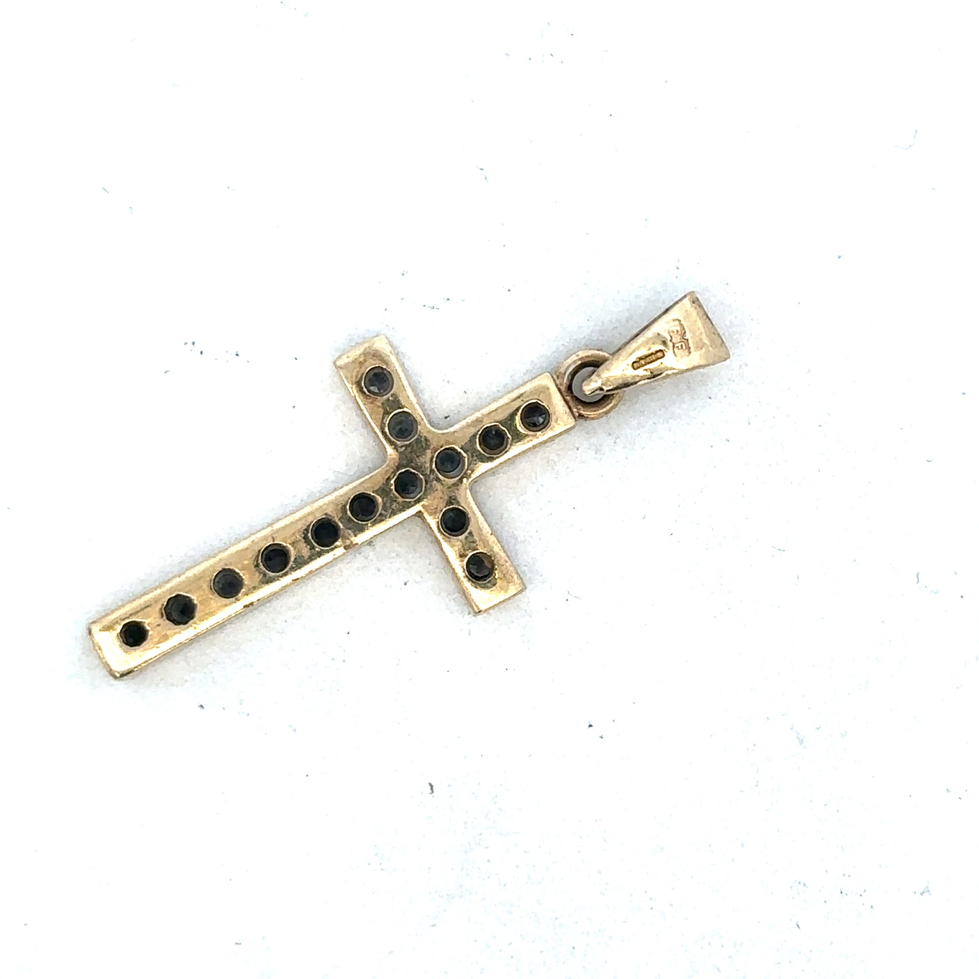 9ct yellow gold cross pendant with detailed design, featuring Reeves and Sons branding, displayed on a neutral background.