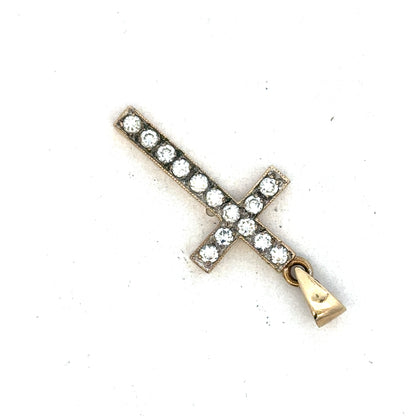 9ct yellow gold cross pendant by Reeves and Sons, showing detailed design and polished finish on a plain background.