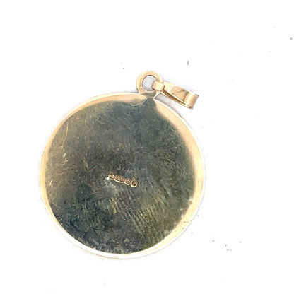 9ct yellow gold St Christopher pendant by Reeves and Sons, featuring a detailed religious medal with a jump ring for necklace attachment.