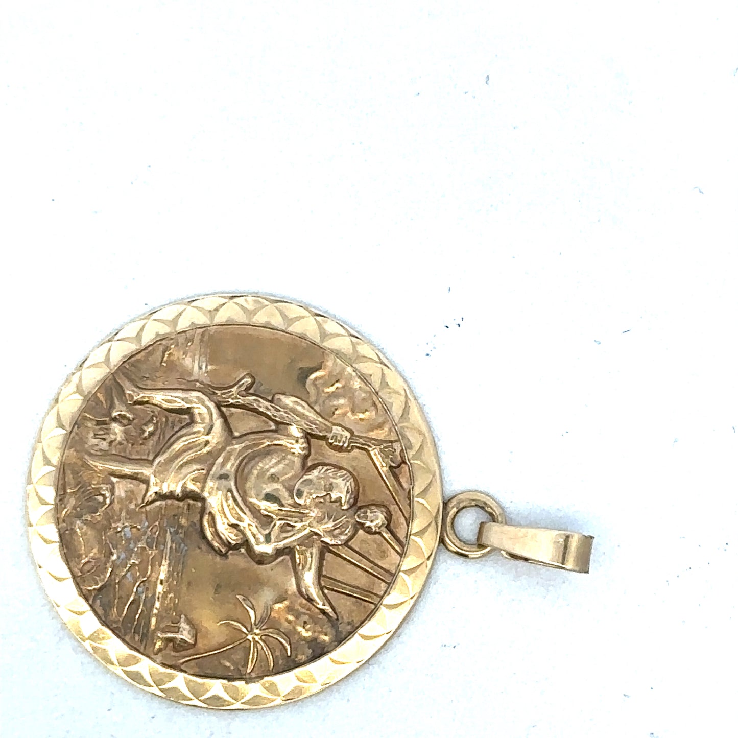 9ct yellow gold St Christopher pendant by Reeves and Sons, featuring detailed religious iconography on a polished gold setting.