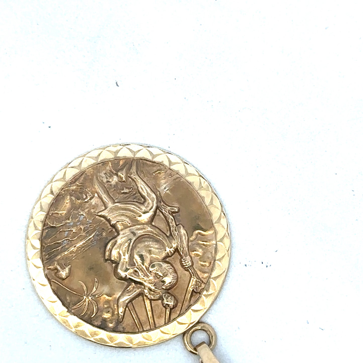 9ct yellow gold St Christopher pendant by Reeves and Sons, featuring detailed religious medal on a chain.