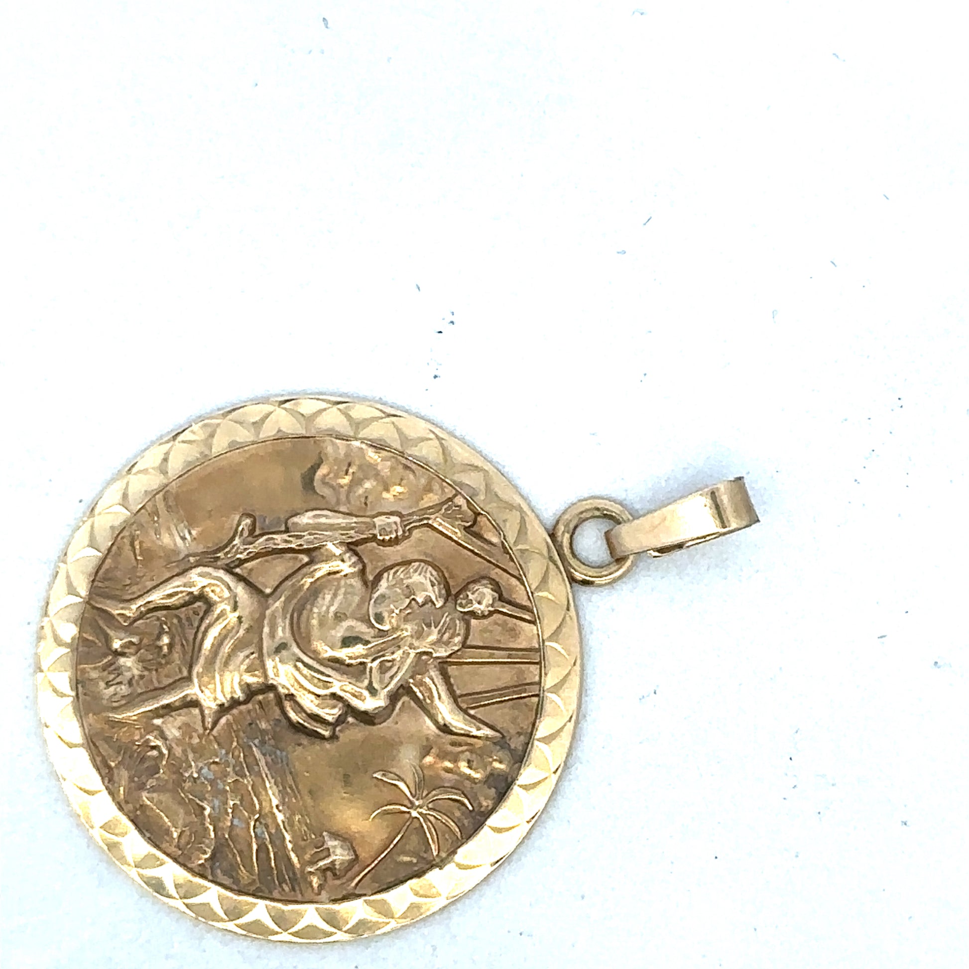 9ct yellow gold St Christopher pendant by Reeves and Sons, featuring a detailed religious medal design.