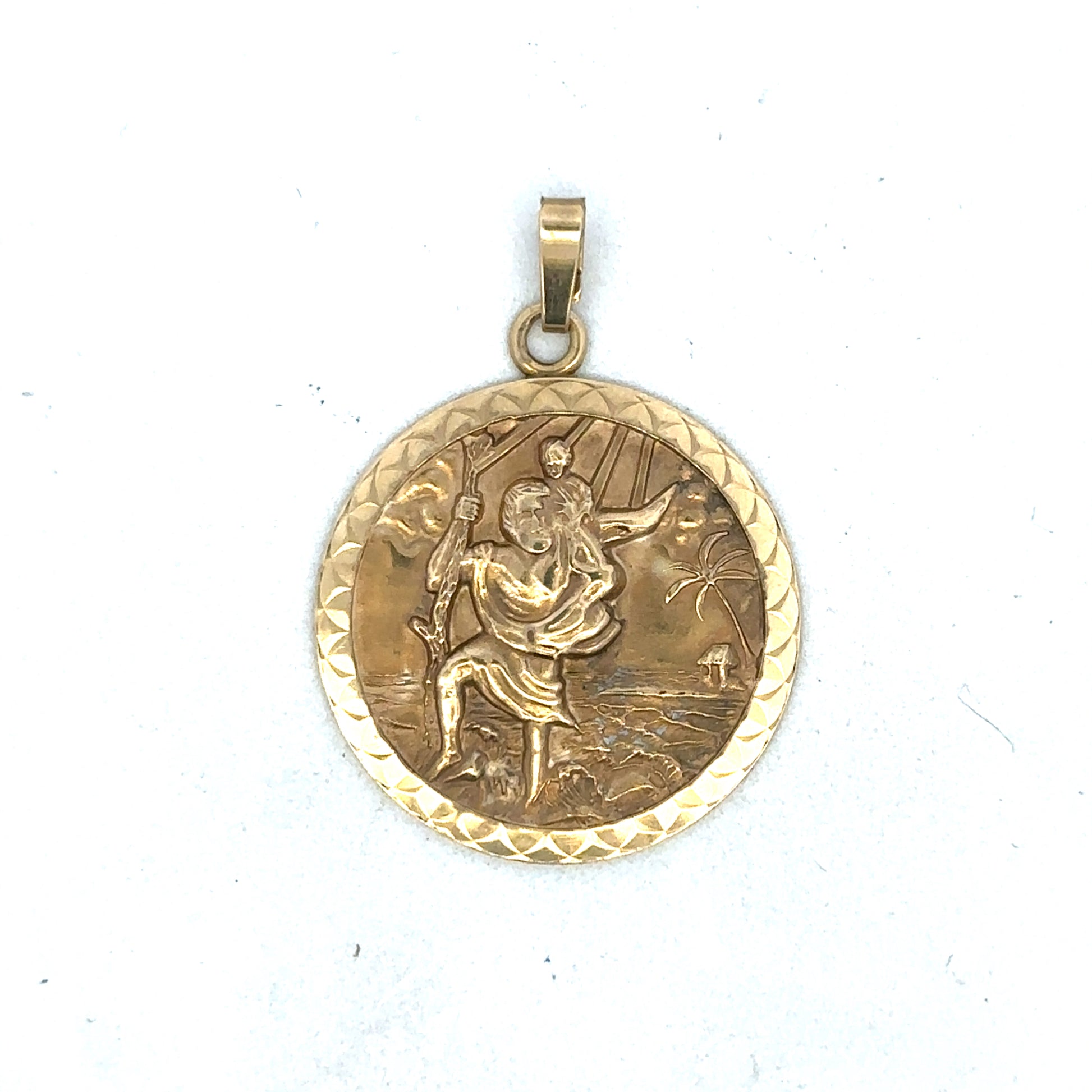 9ct yellow gold St Christopher pendant by Reeves and Sons, showing intricate religious medal with detailed engraving.