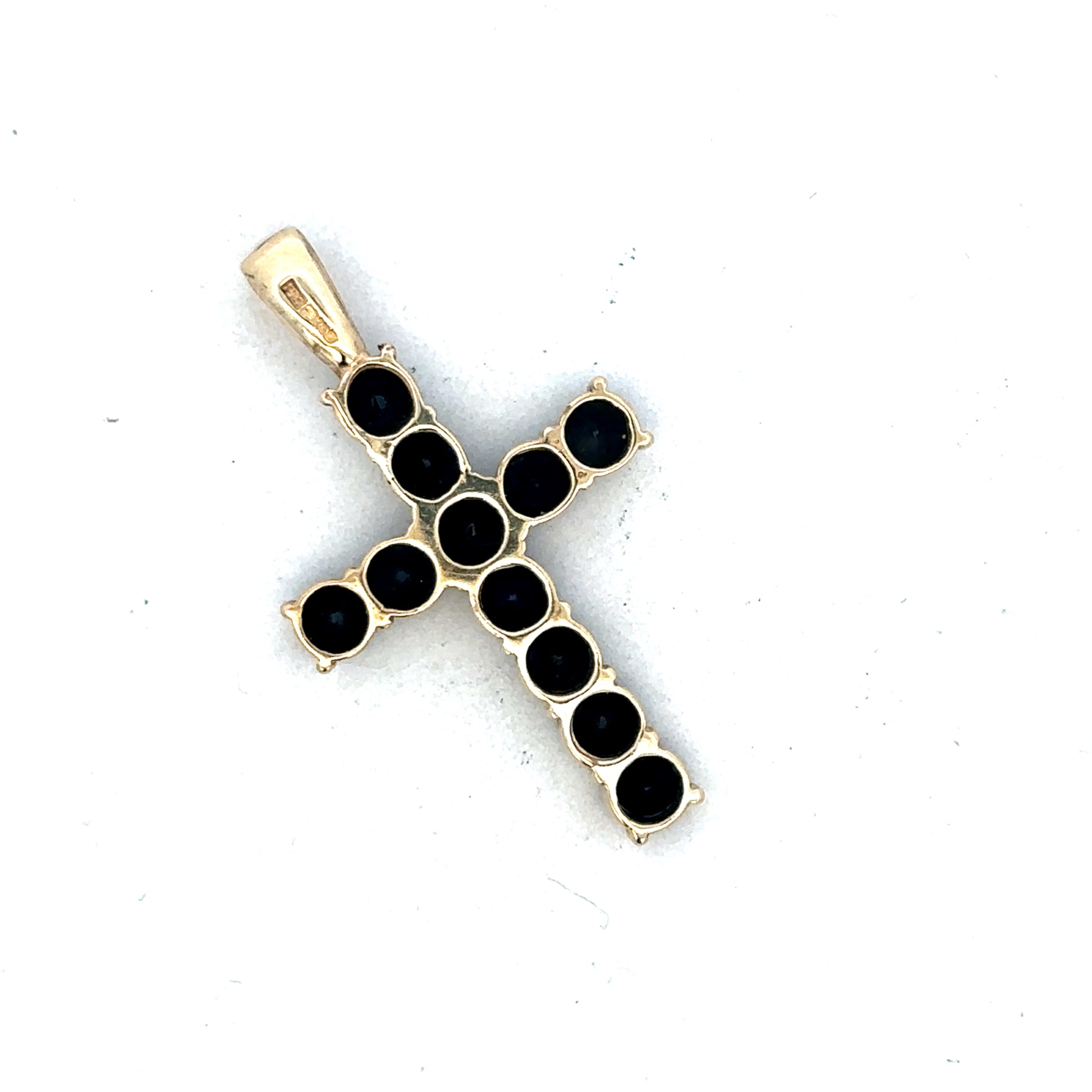 9ct yellow gold cross pendant by Reeves and Sons, featuring a simple and elegant design, shown in a close-up image.