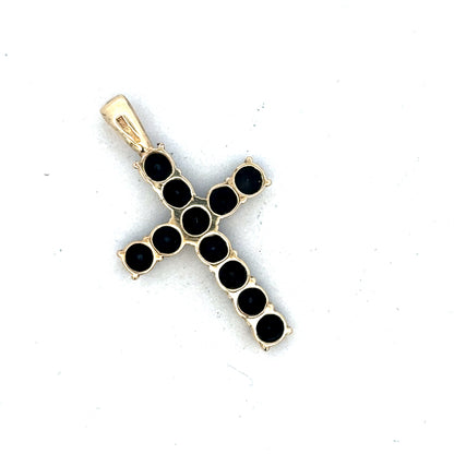9ct yellow gold cross pendant by Reeves and Sons, featuring a simple and elegant design, shown in a close-up image.