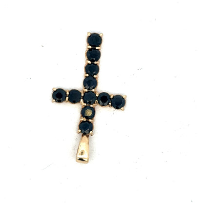 9ct yellow gold cross pendant by Reeves and Sons, showcasing a detailed pendant design on a chain.