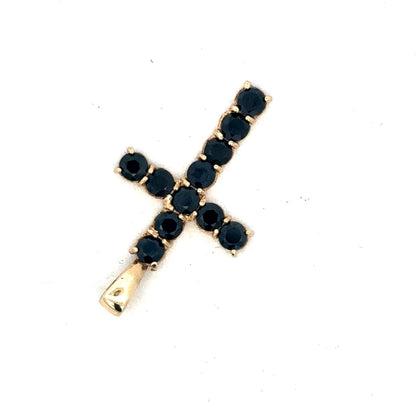 9ct yellow gold cross pendant by Reeves and Sons, showcasing a detailed religious jewelry piece with a smooth finish.