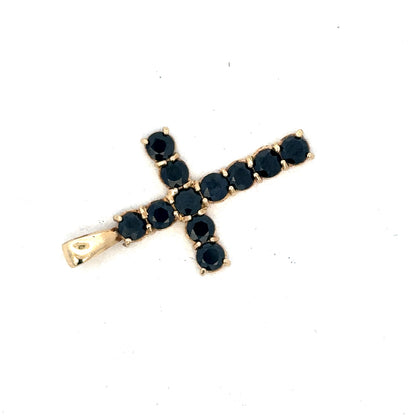 9ct yellow gold cross pendant by Reeves and Sons, featuring a detailed religious symbol design.