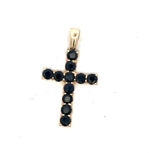 9ct yellow gold cross pendant by Reeves and Sons, showcasing a detailed religious jewelry design on a white background.