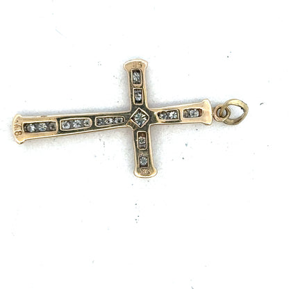 9ct yellow gold diamond cross pendant by Reeves and Sons, showcasing a detailed gold pendant with sparkling diamonds.
