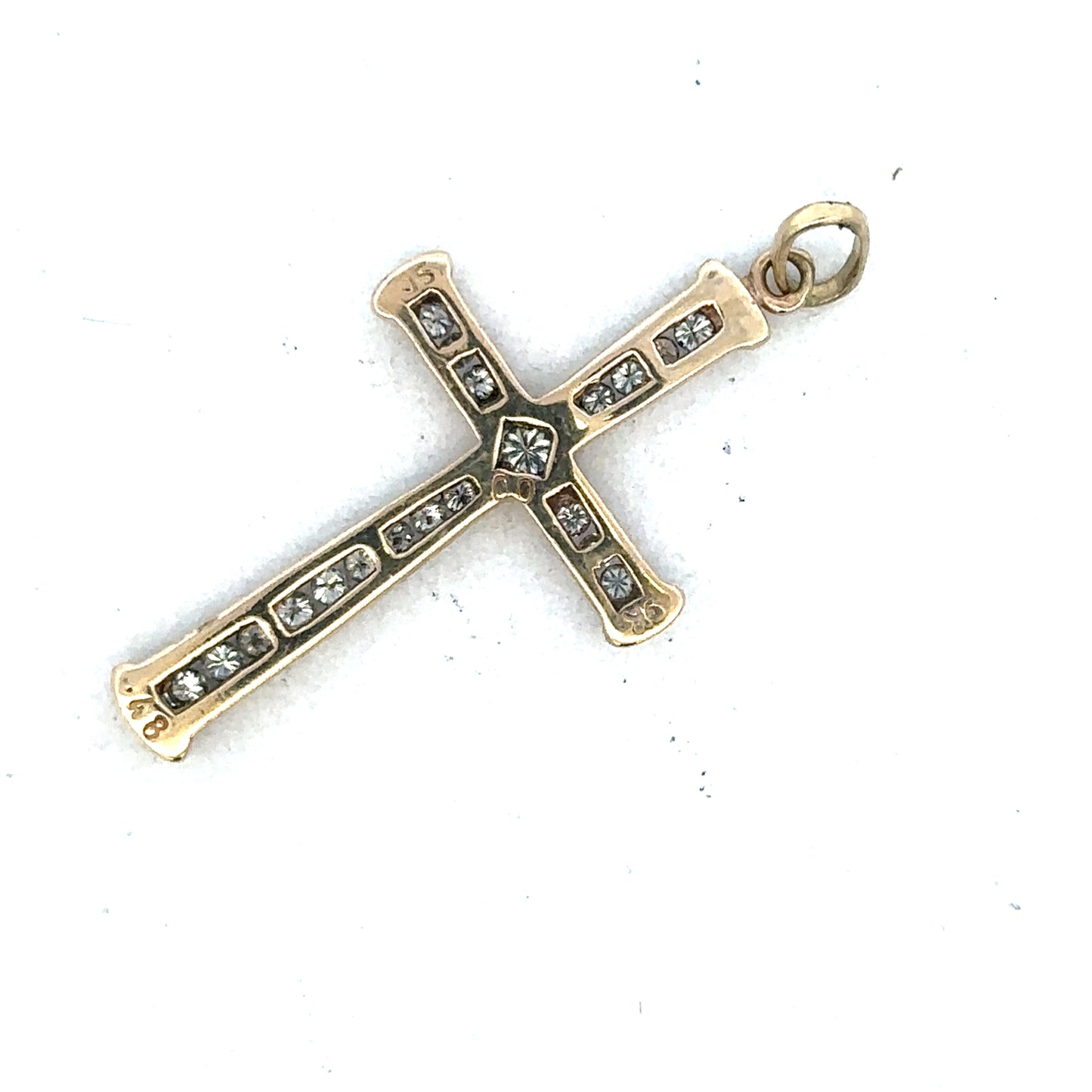 Yellow gold diamond cross pendant by Reeves and Sons, 9ct gold with sparkling diamonds, showcasing the detailed religious jewelry design.