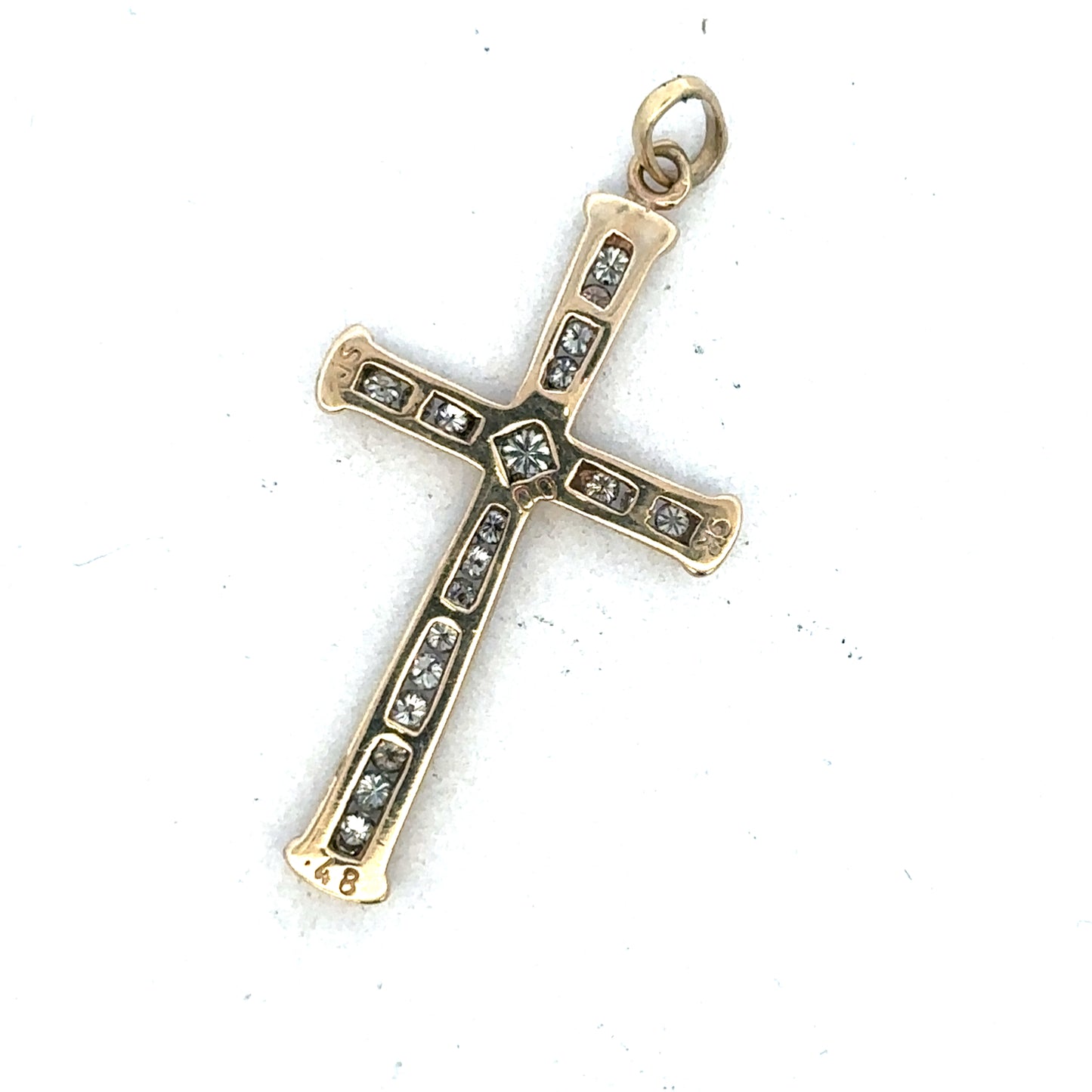 9ct yellow gold diamond cross pendant from Reeves and Sons, featuring a detailed religious jewelry design.