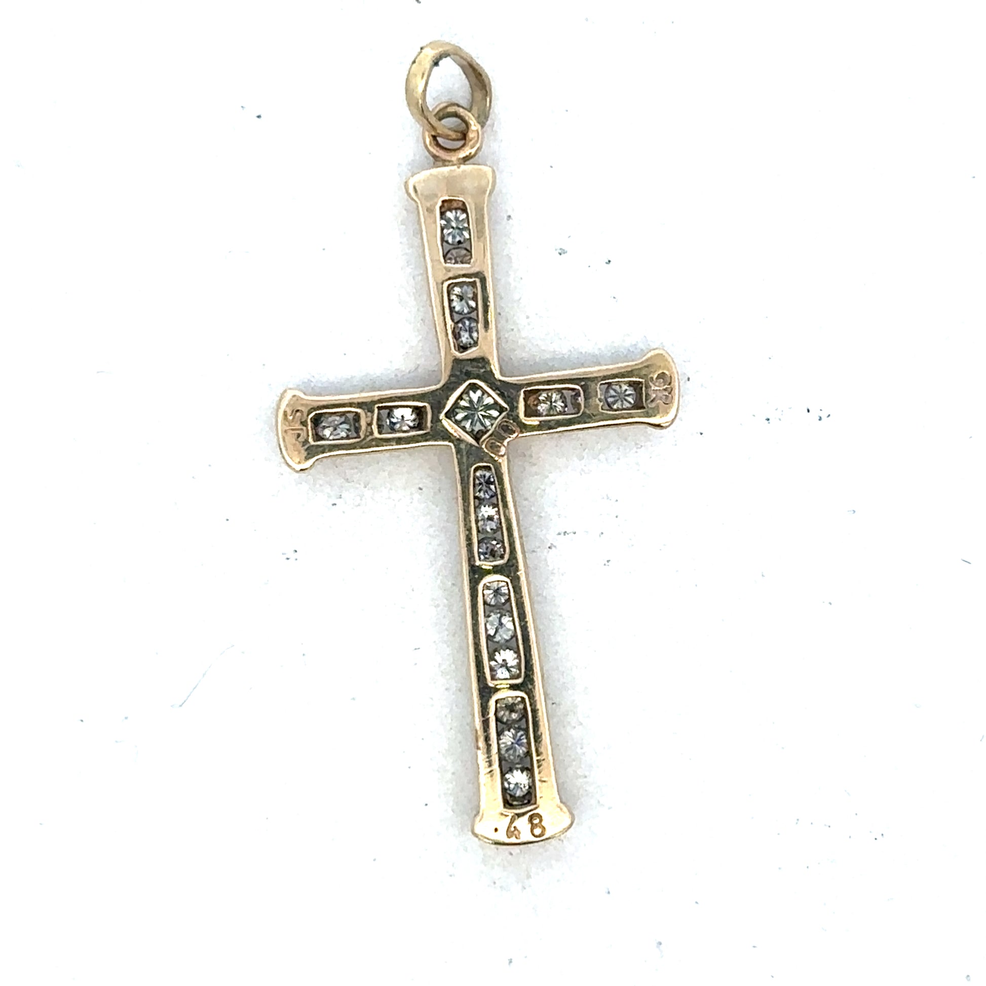 9ct yellow gold diamond cross pendant by Reeves and Sons, featuring sparkling diamonds on a delicate gold chain.