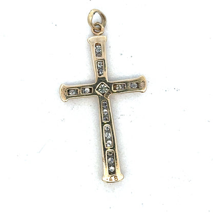 9ct yellow gold diamond cross pendant by Reeves and Sons, featuring sparkling diamonds on a delicate gold chain.